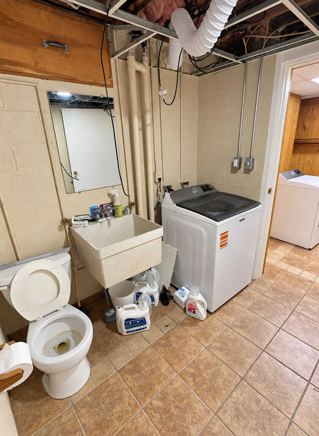 Utility area before its conversion into a bathroom